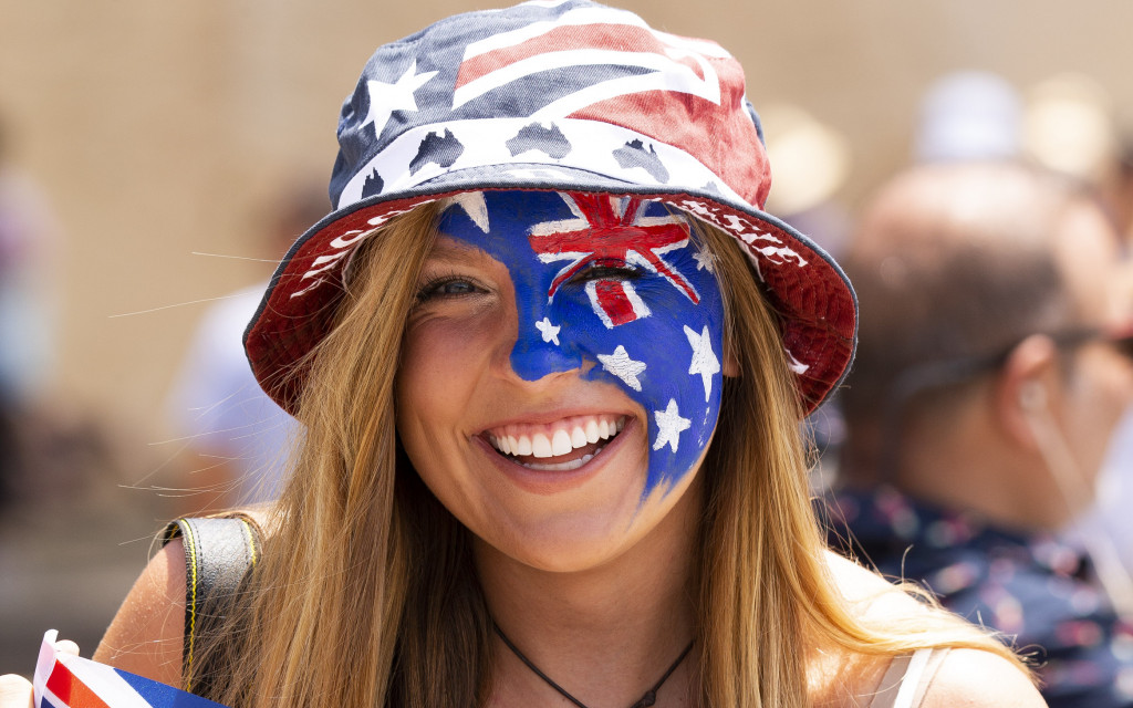 Woman with Australia Day flag and face paint