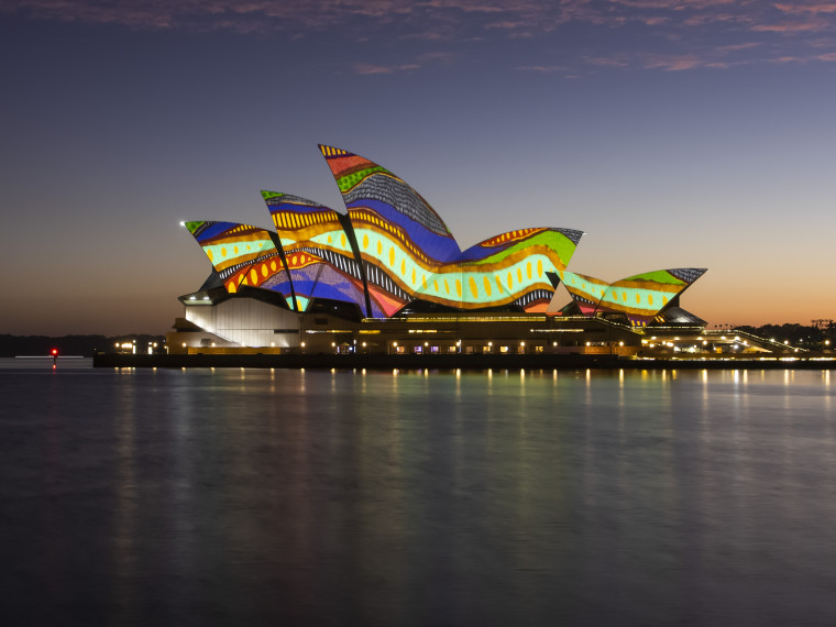Artwork by Frances Belle-Parker projected on the sails of the Sydney Opera House at dawn
