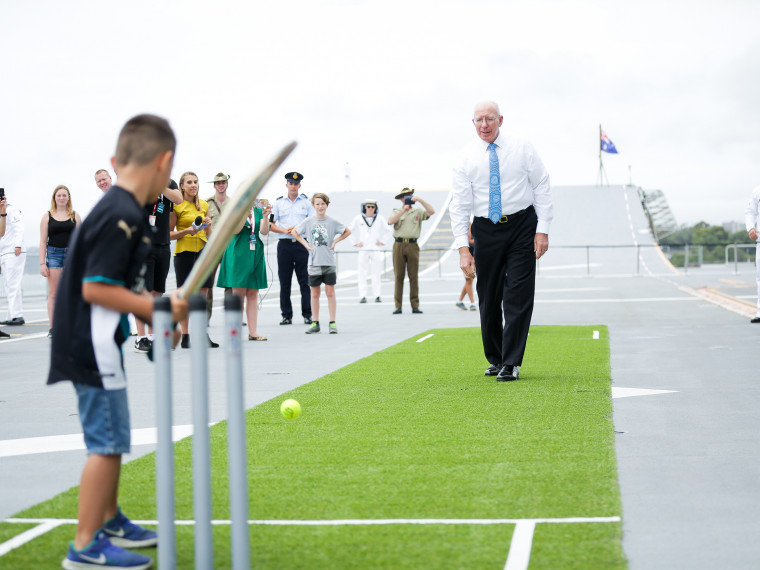 His Excellency General The Honourable David Hurley AC DSC Retd Governor of NSW plays backyard cricket on board the HMAS Canberra on Australia Day 2018