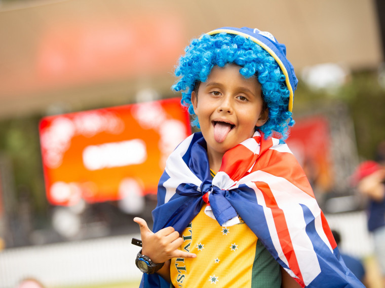 Rugby League fan wearing a blue wig at the Summer Playground in Darling Harbour
