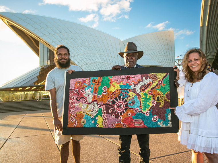 Goanna Songline Ngintaka Inma artwork by Yadjidta David Miller (centre) Yvonne Weldon Deputy Chair of the Australia Day Council of NSW