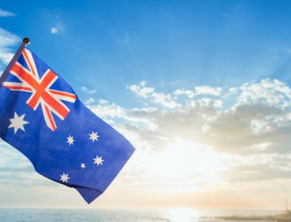 An Australian flag flying on a sunny day