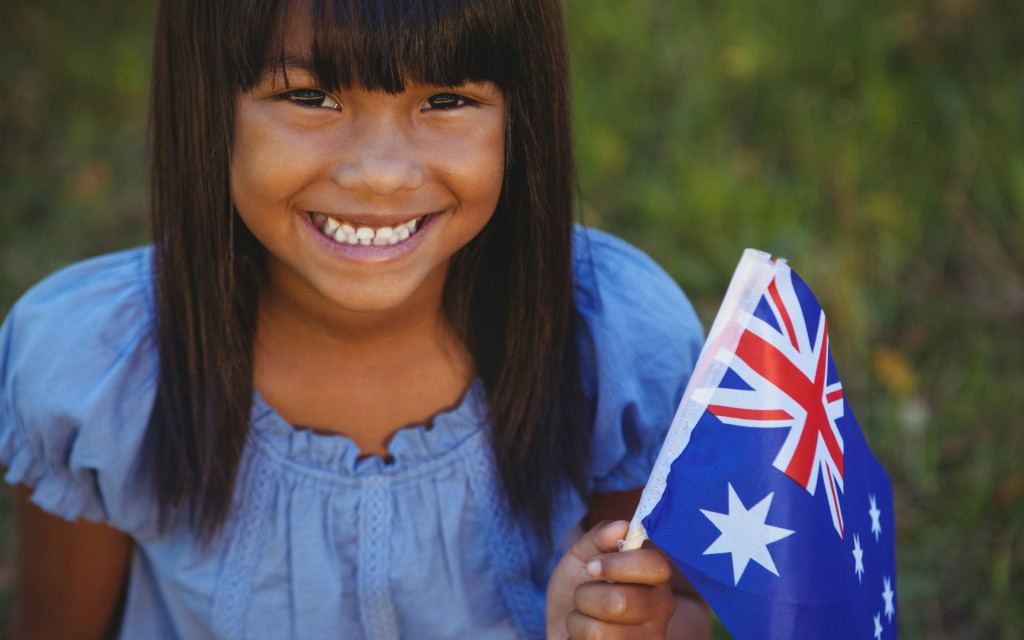 Little girl holding an Australian flag