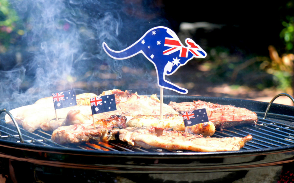 Meat cooking on a BBQ with a kangaroo shaped Australian Flag toothpick