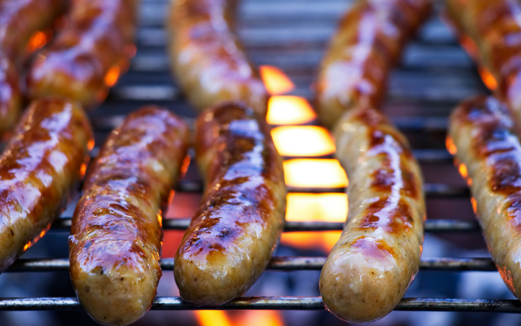 Sausages being grilled on a BBQ