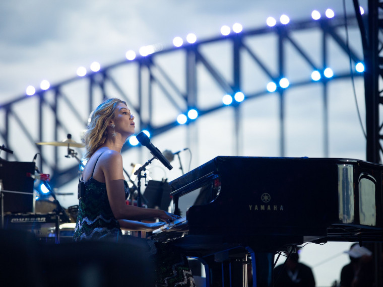 Delta Goodrem performing at piano at Australia Day Live at Sydney Opera House